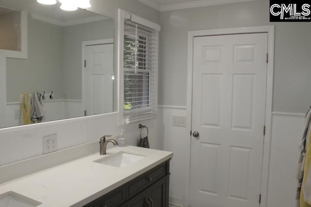 bathroom featuring vanity and ornamental molding