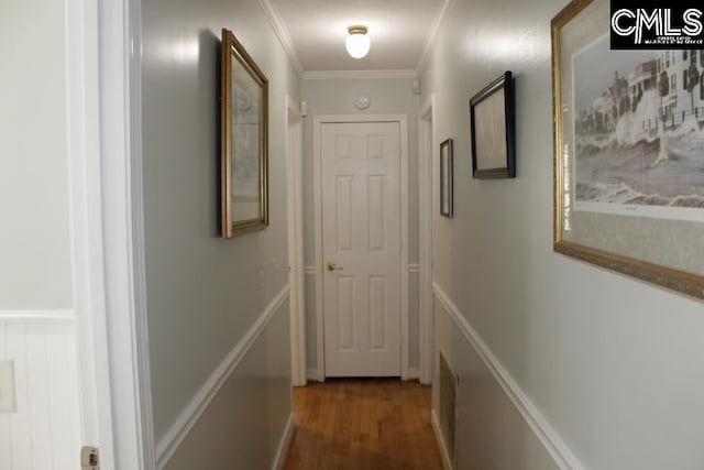 corridor featuring crown molding and dark hardwood / wood-style floors