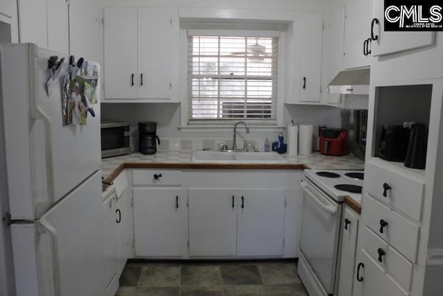 kitchen featuring white cabinetry, sink, and white appliances