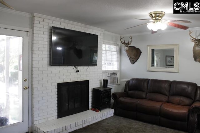 living room with a wealth of natural light, crown molding, and ceiling fan