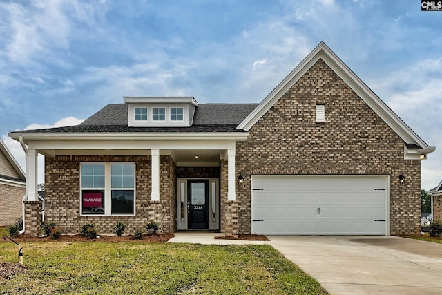 craftsman-style home with a garage and a front yard