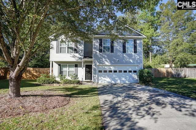 view of front of house with a garage and a front yard