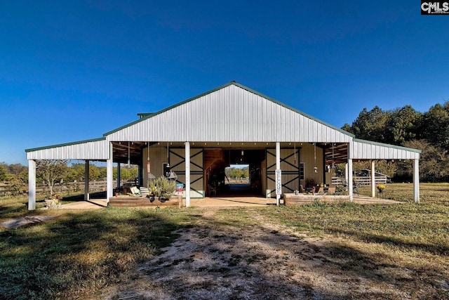 view of outdoor structure featuring a lawn