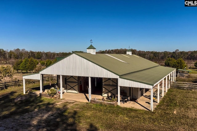 view of outbuilding featuring a rural view