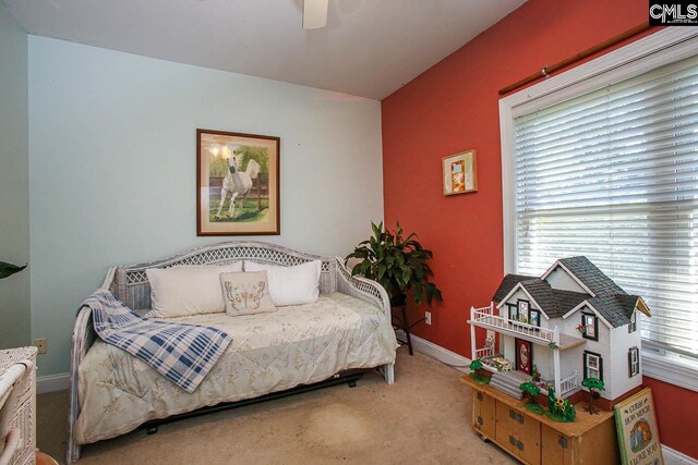 carpeted bedroom featuring ceiling fan