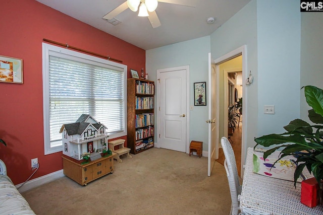 interior space with ceiling fan