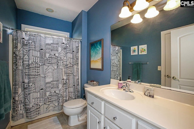 bathroom with toilet, tile patterned flooring, vanity, and a shower with curtain