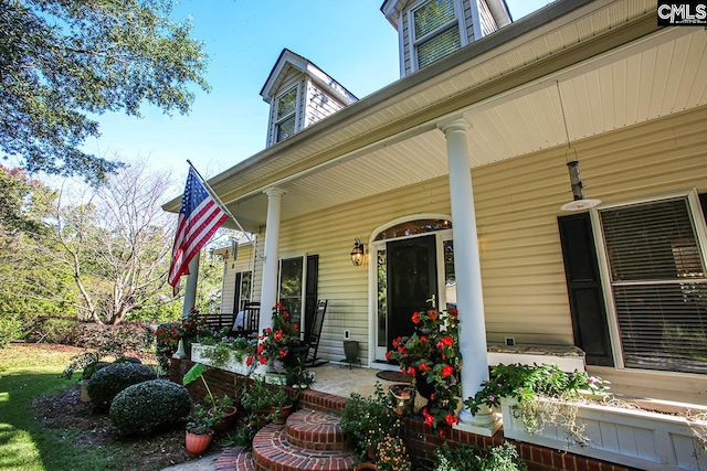 doorway to property with covered porch