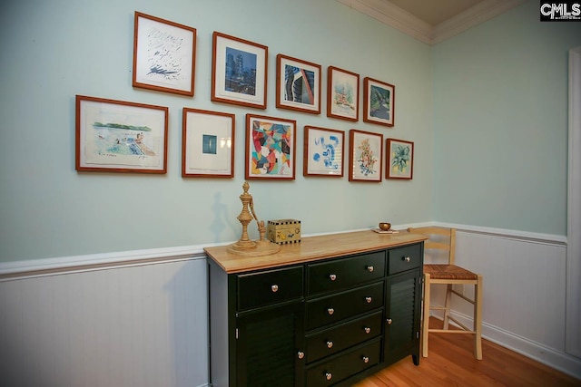 details featuring crown molding and hardwood / wood-style floors