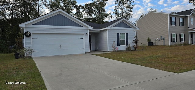 view of front of home featuring a garage, a front yard, and central AC unit