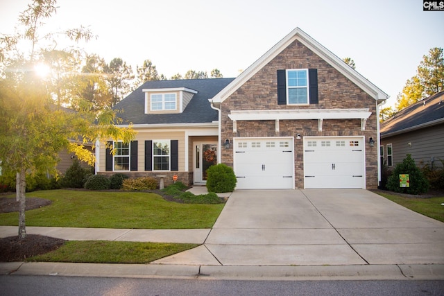 craftsman-style house with a front yard and a garage