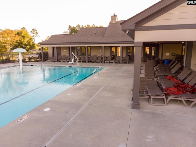 view of swimming pool with a patio