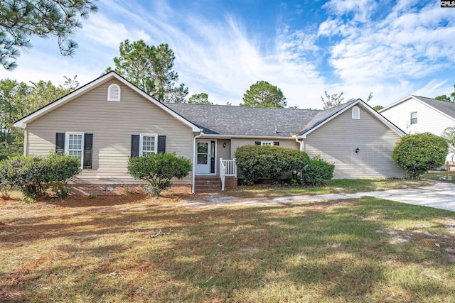 ranch-style home featuring a front yard