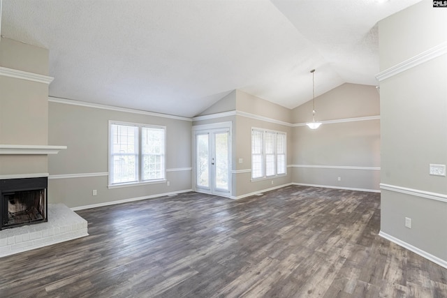 unfurnished living room featuring a fireplace, dark hardwood / wood-style floors, vaulted ceiling, and a textured ceiling