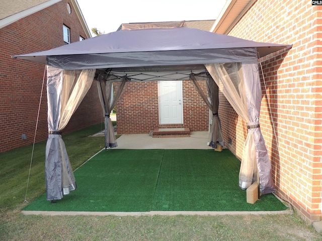 exterior space with a yard and a gazebo