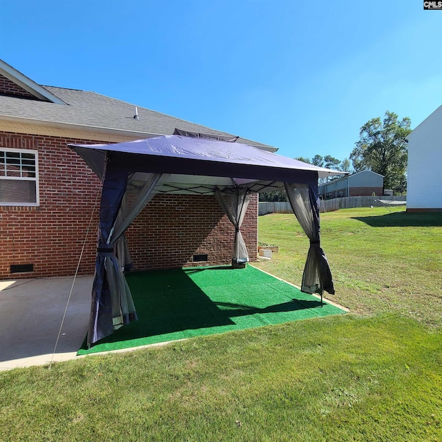 view of yard with a gazebo and a patio area