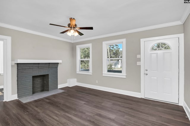 unfurnished living room with ceiling fan, ornamental molding, a fireplace, and dark hardwood / wood-style flooring