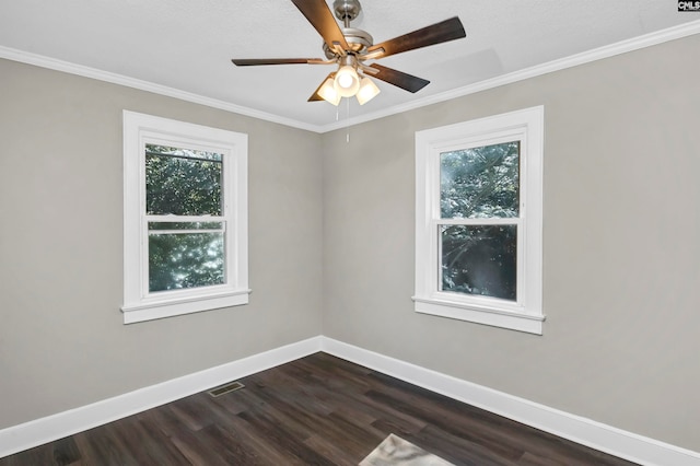 unfurnished room with crown molding, ceiling fan, and dark hardwood / wood-style flooring