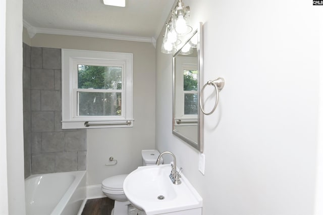 bathroom featuring hardwood / wood-style floors, a healthy amount of sunlight, toilet, and a textured ceiling