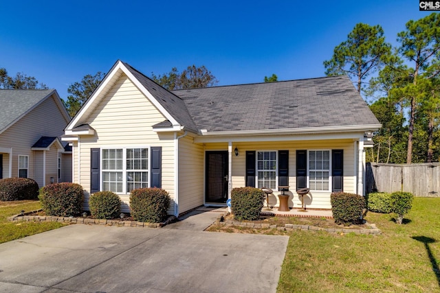 view of front of home with a front yard and a porch