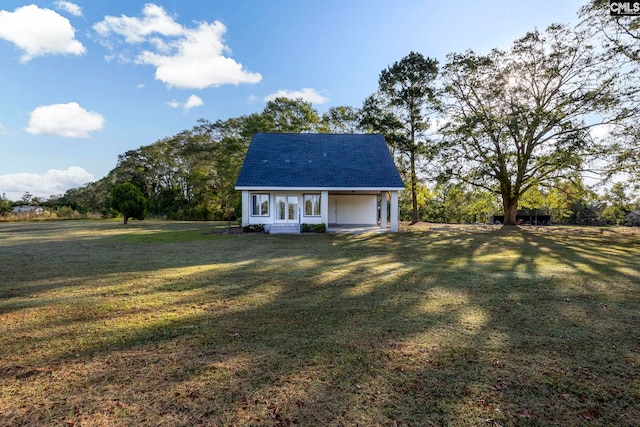 view of outbuilding featuring a yard