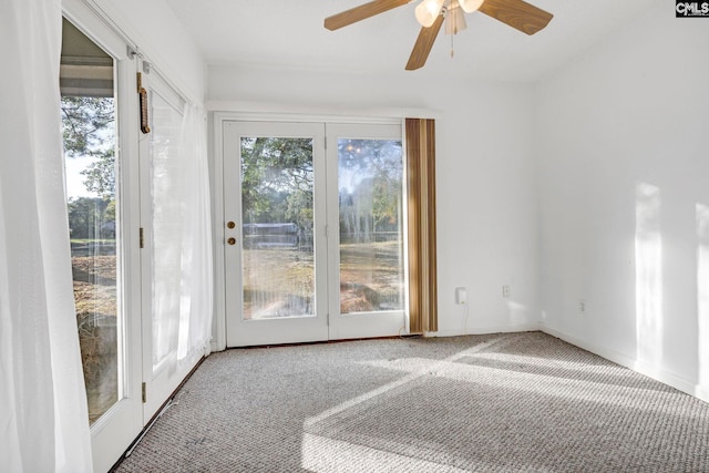 interior space featuring ceiling fan and plenty of natural light