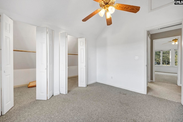 unfurnished bedroom with vaulted ceiling, carpet floors, and ceiling fan