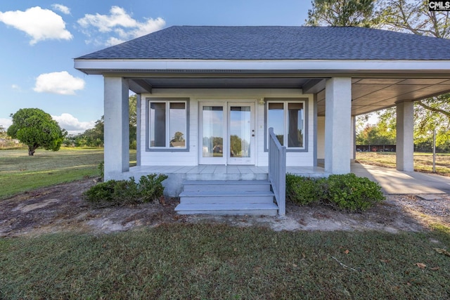 view of front of house with a front yard and a carport