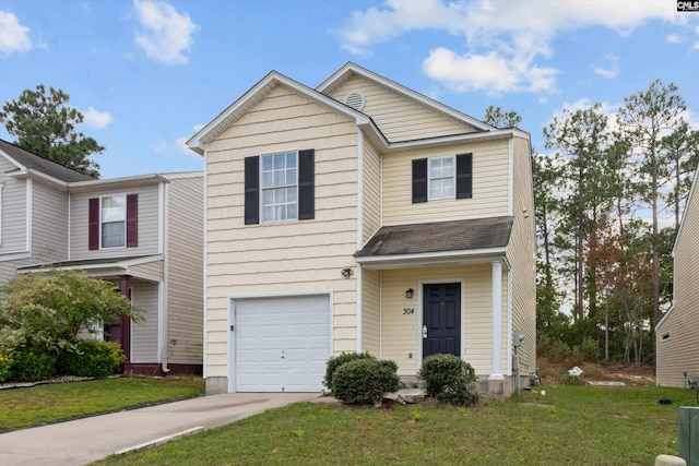 view of front of house featuring a front yard and a garage