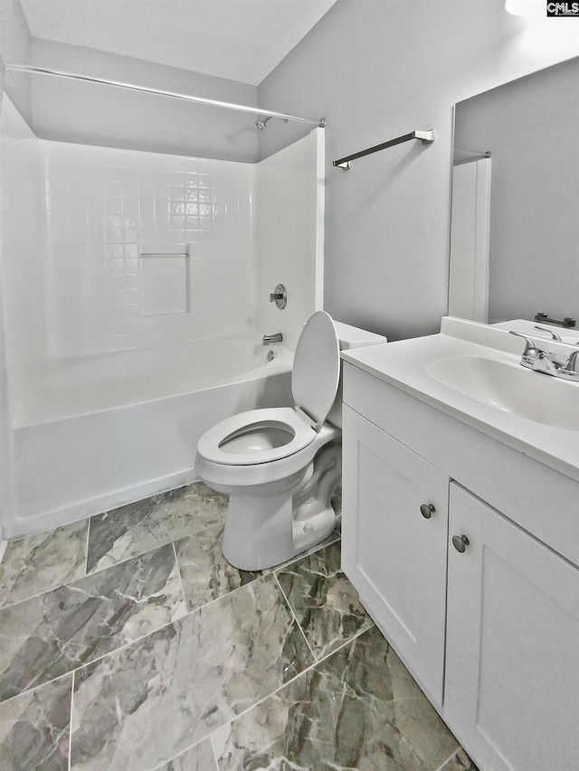 full bathroom featuring toilet, vanity, and washtub / shower combination