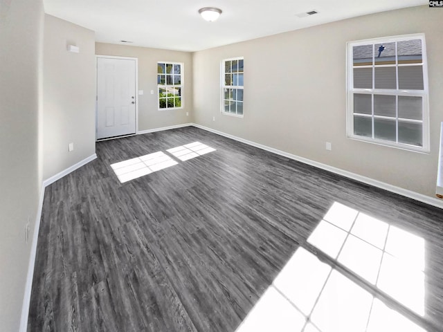 spare room with dark hardwood / wood-style floors