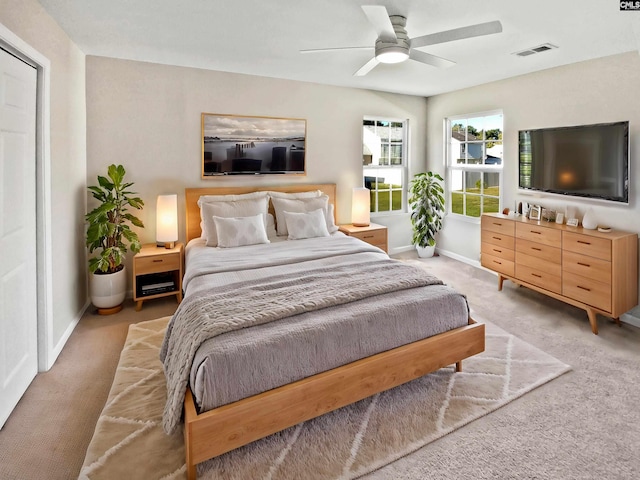 carpeted bedroom with ceiling fan