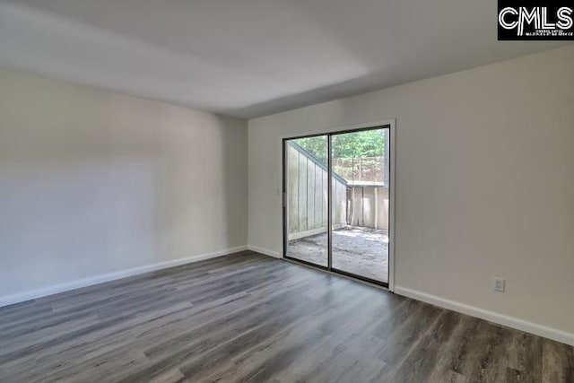 empty room with dark wood-type flooring