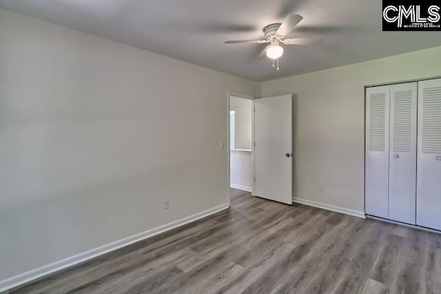 unfurnished bedroom featuring a closet, ceiling fan, and light hardwood / wood-style floors