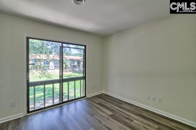 empty room featuring dark hardwood / wood-style floors