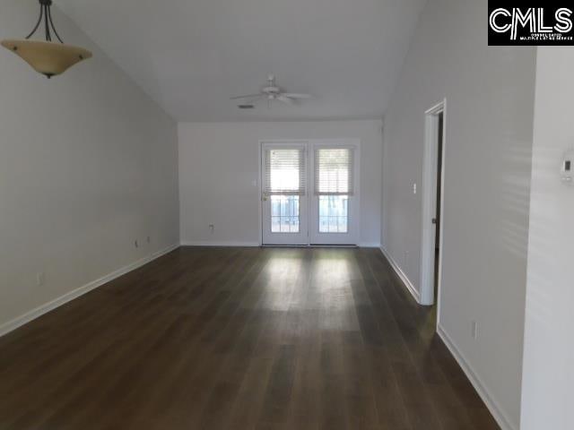 unfurnished room with lofted ceiling, french doors, ceiling fan, and dark hardwood / wood-style flooring