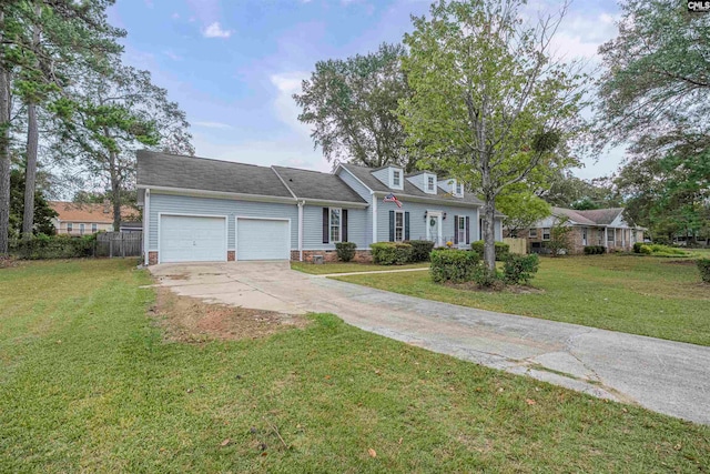 view of front of home with a garage and a front yard