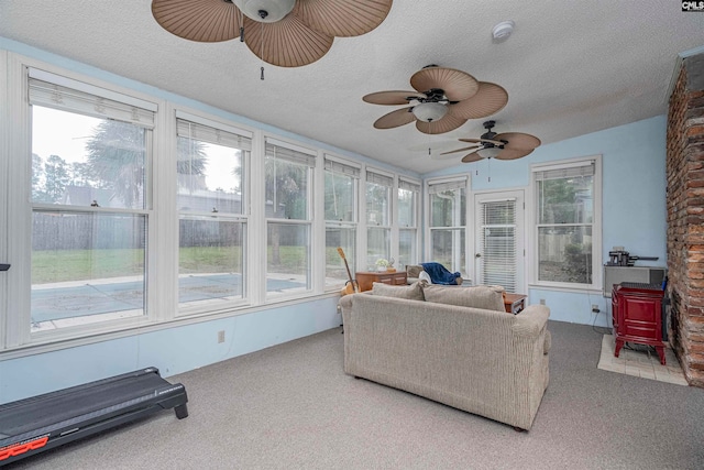 sunroom / solarium with ceiling fan