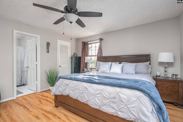 bedroom featuring ceiling fan, a closet, a textured ceiling, and hardwood / wood-style flooring