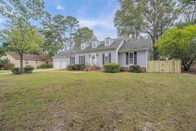 new england style home featuring a front yard and a garage