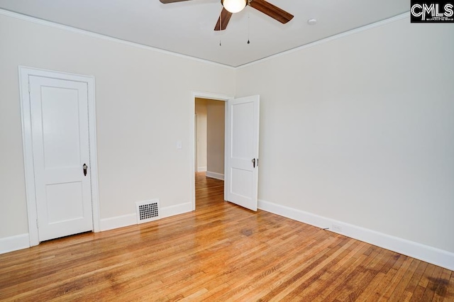 spare room featuring light hardwood / wood-style flooring, ceiling fan, and crown molding