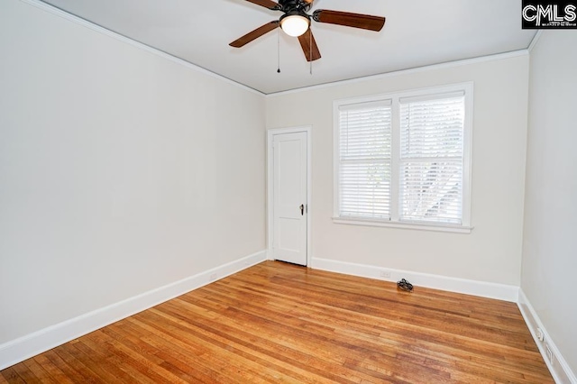 empty room with light hardwood / wood-style floors, crown molding, and ceiling fan