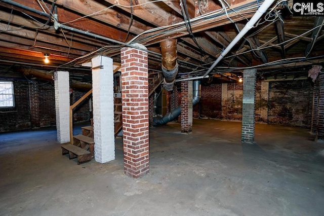 basement with brick wall