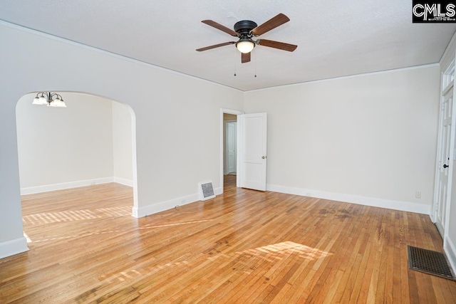 spare room with light hardwood / wood-style flooring and ceiling fan