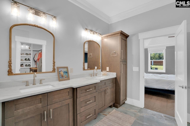 bathroom with vanity and ornamental molding