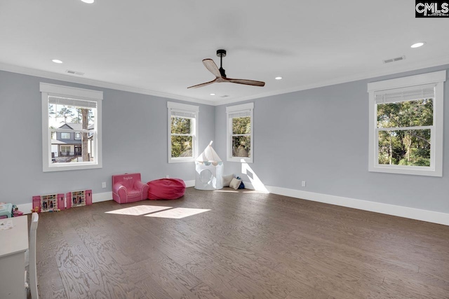 game room with ornamental molding, hardwood / wood-style flooring, and ceiling fan