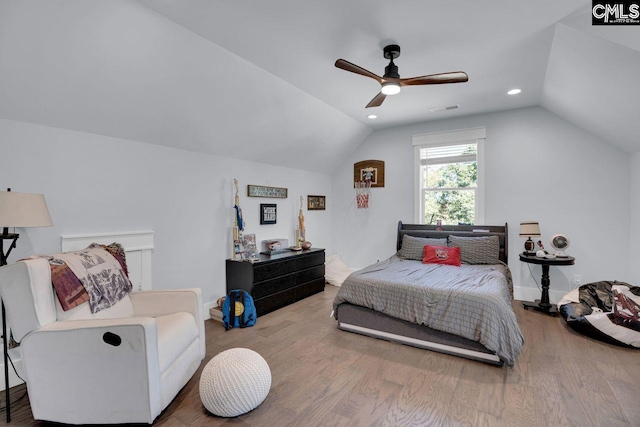 bedroom with lofted ceiling, hardwood / wood-style floors, and ceiling fan