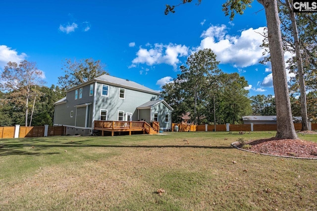 view of yard with a wooden deck