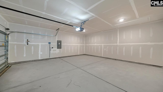 garage featuring a garage door opener and electric panel