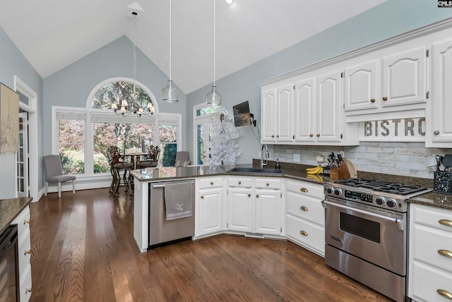 kitchen with stainless steel appliances, white cabinetry, sink, and backsplash